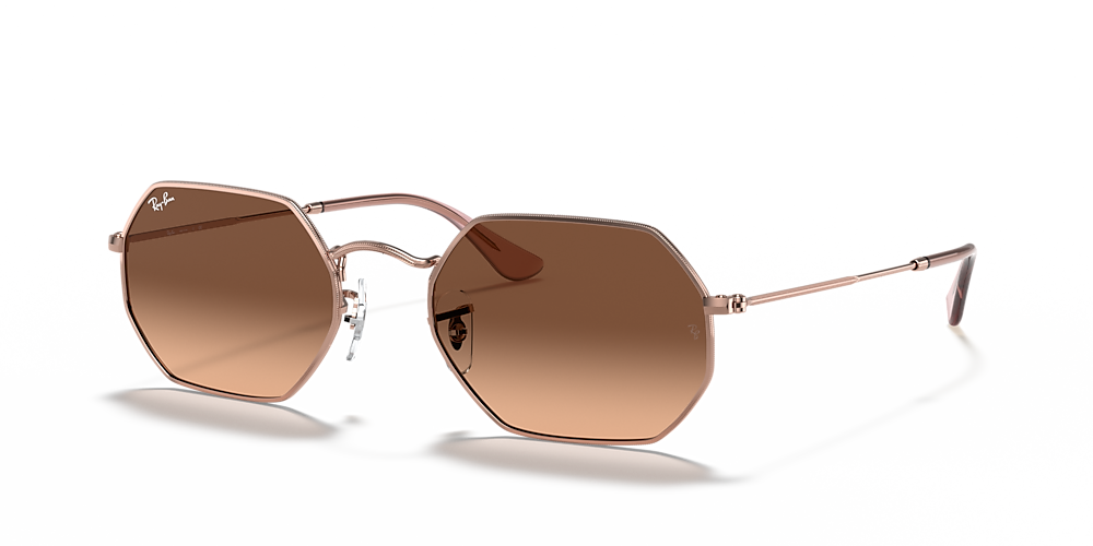 Gafas de sol doradas Ray-Ban con lentes marrón